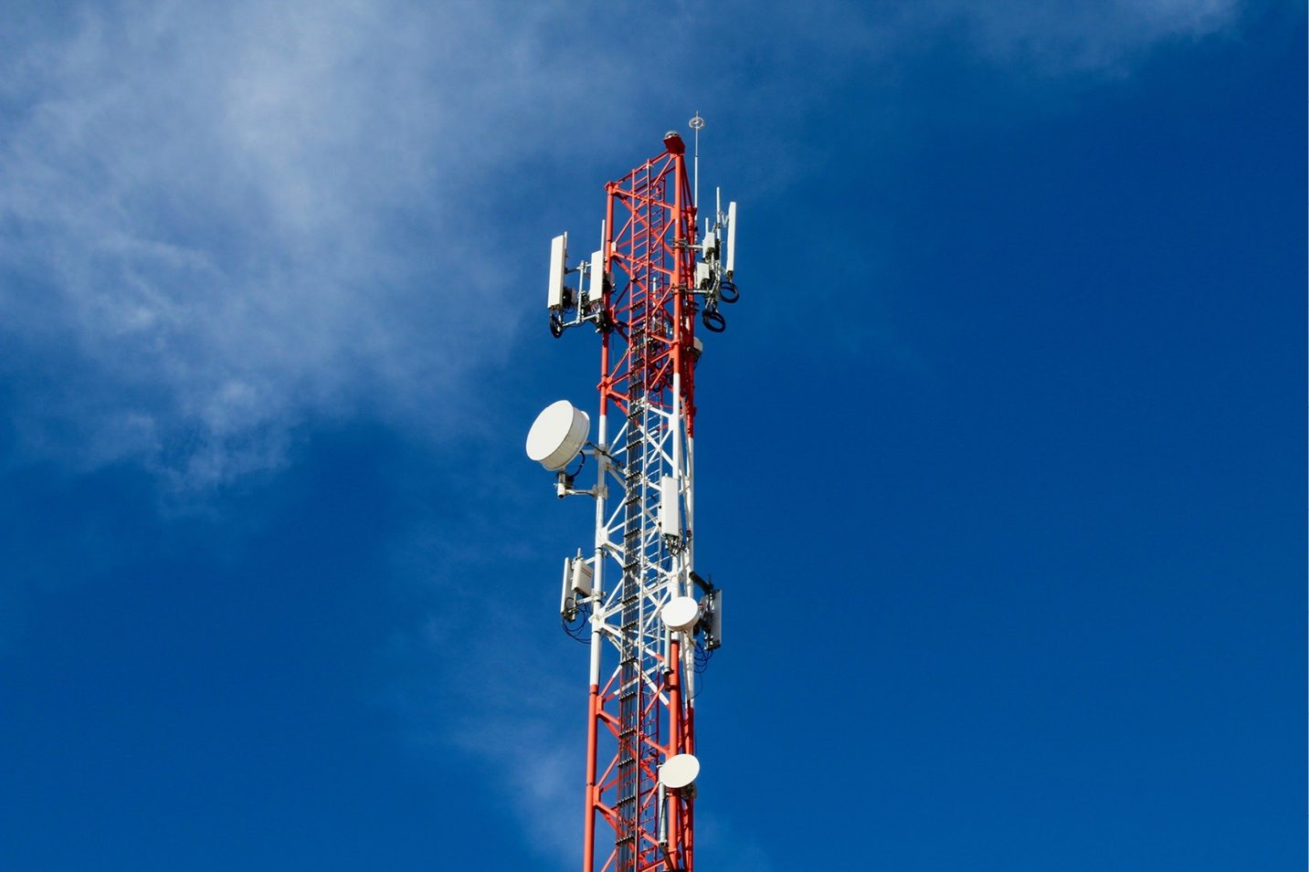 Telecommunications tower against a clear sky