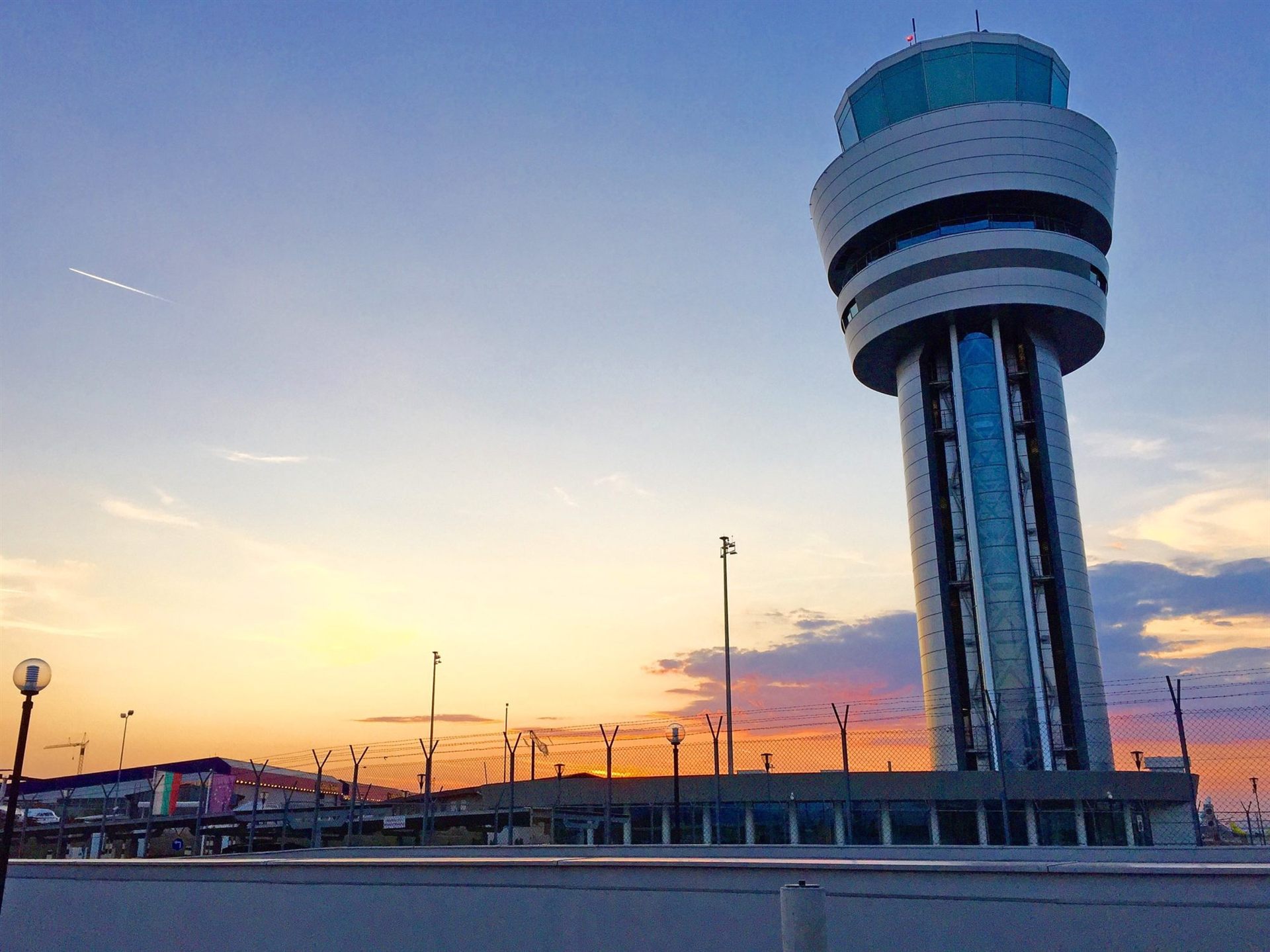 Air traffic control tower at sunset
